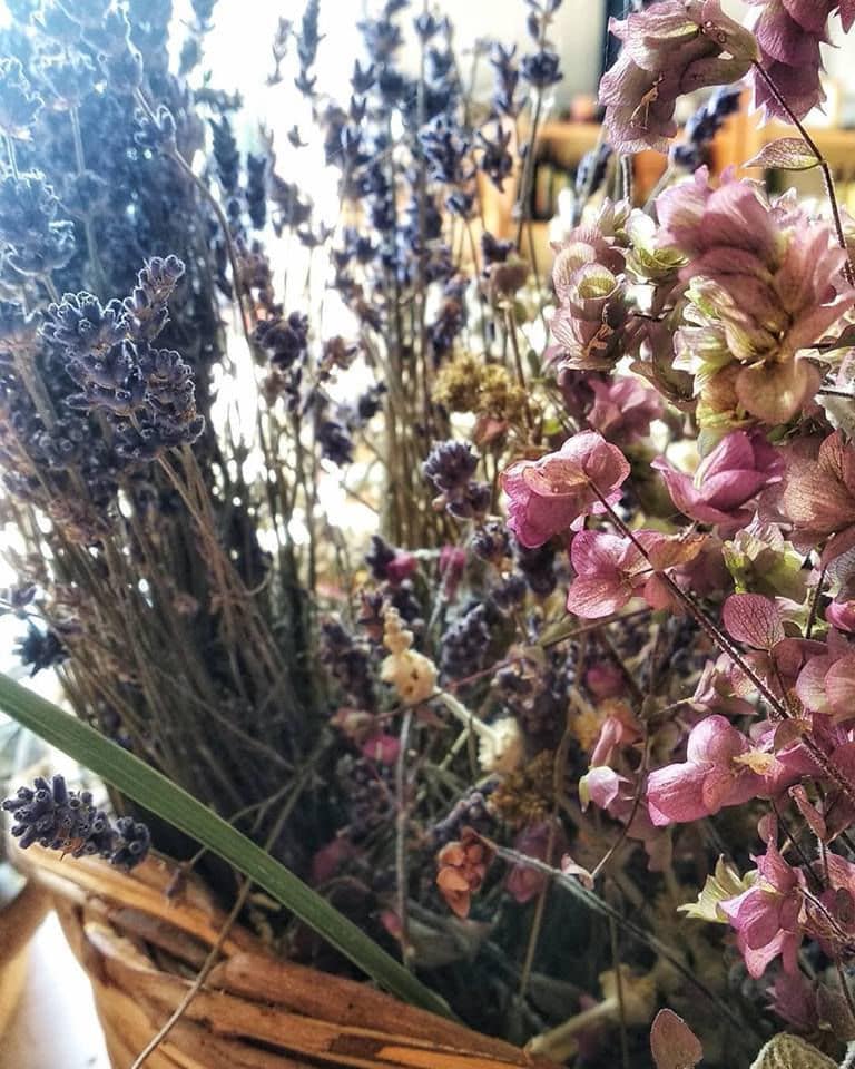 wicker basket with dried bushes of lavandula and others purple flowers from 'Cretian Feast' crops